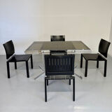 Smoked glass dining table with chrome legs, 1970s design by Roche Bobois.