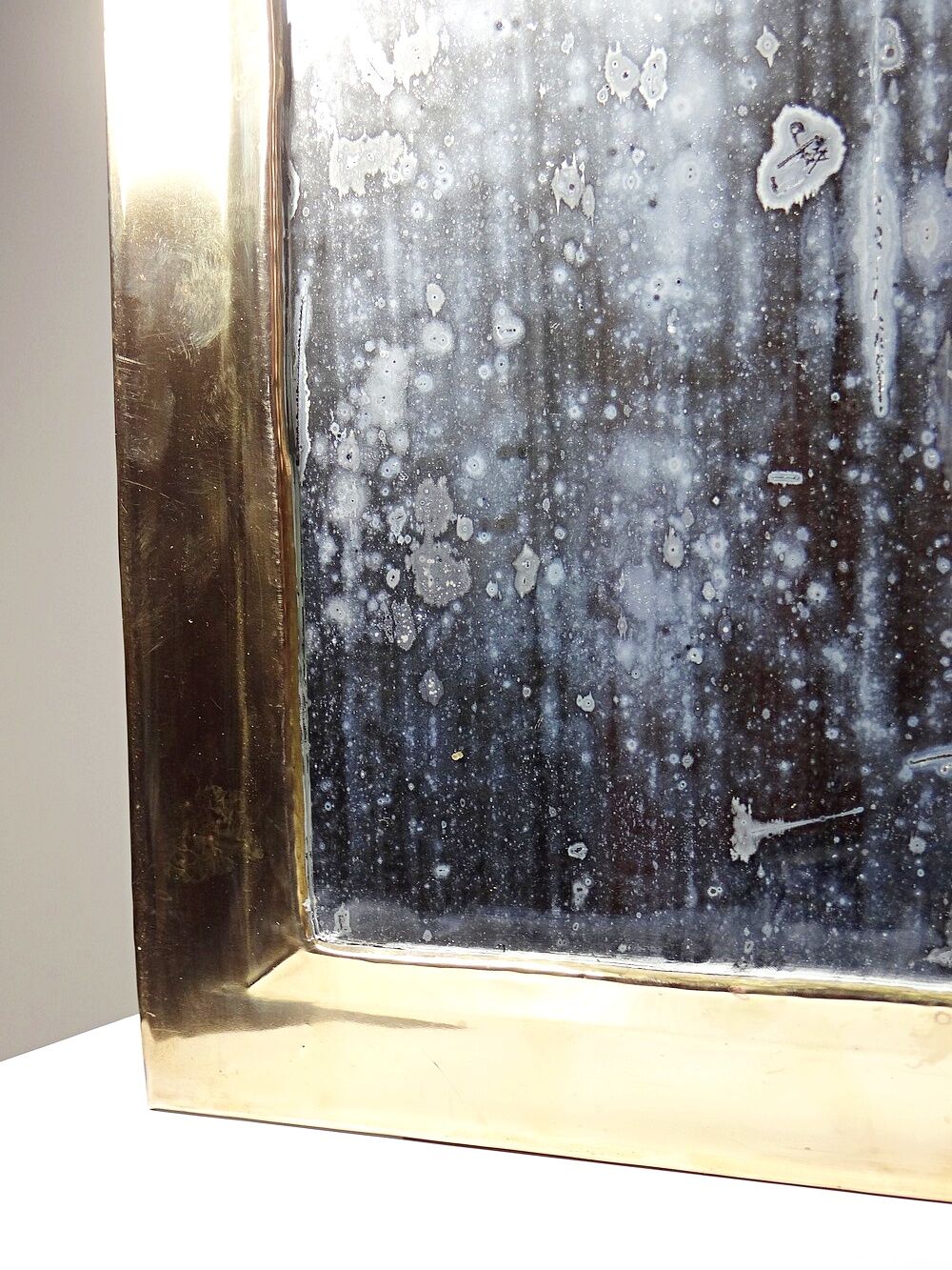 Large vintage Moroccan artisan wall mirror from the 50s-70s, made of solid brass, arch-shaped.