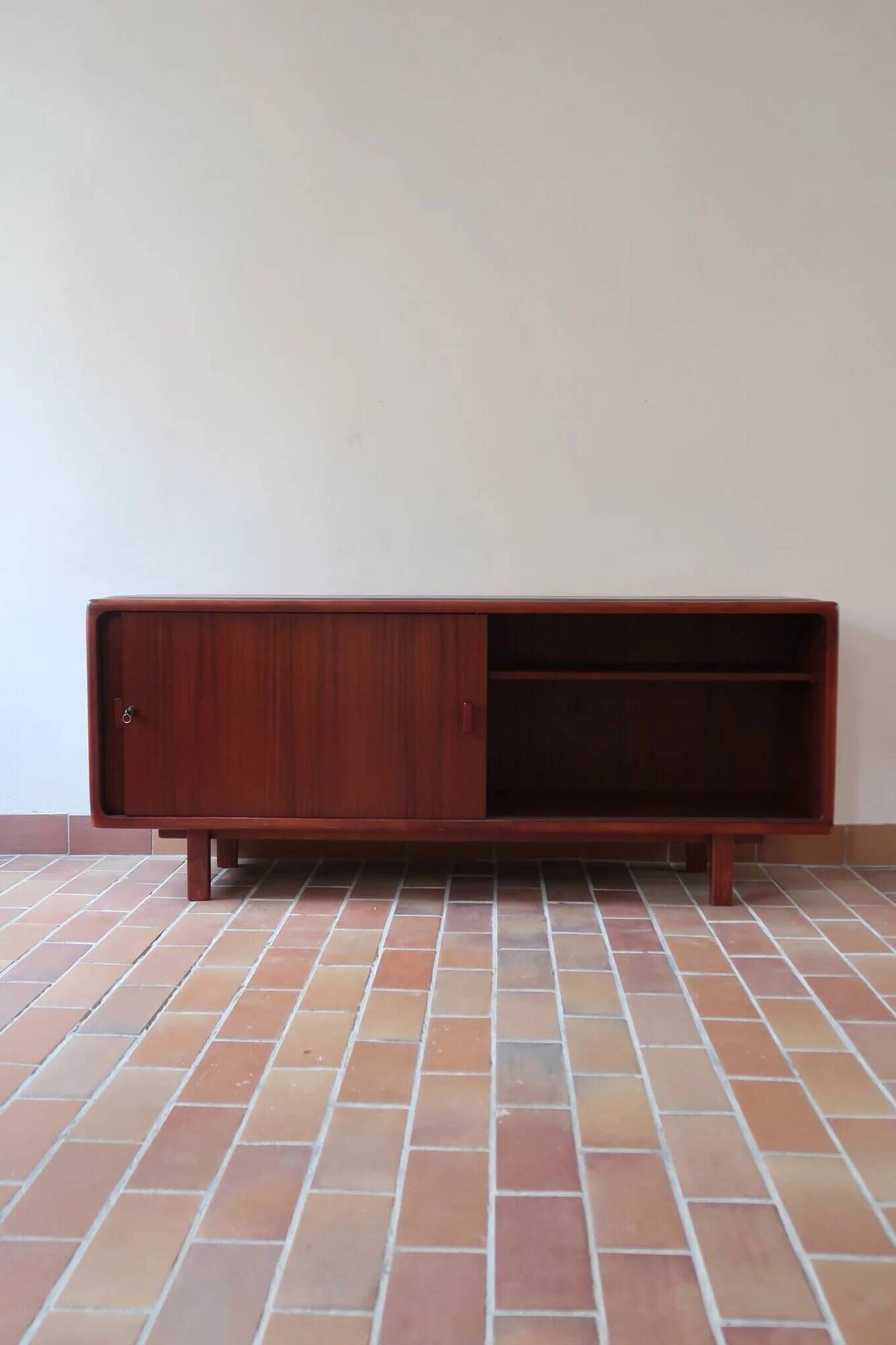 Teak enfilade, sliding doors, black faux leather top, 1970s.