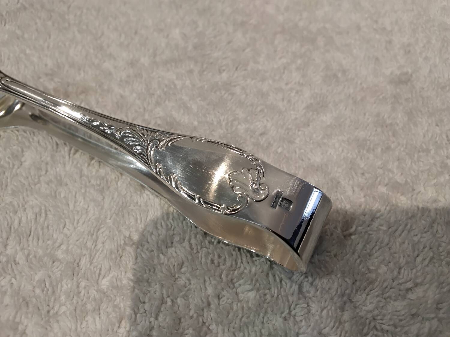 Small silver-plated sugar tongs by Christofle Marly, 11.3 cm