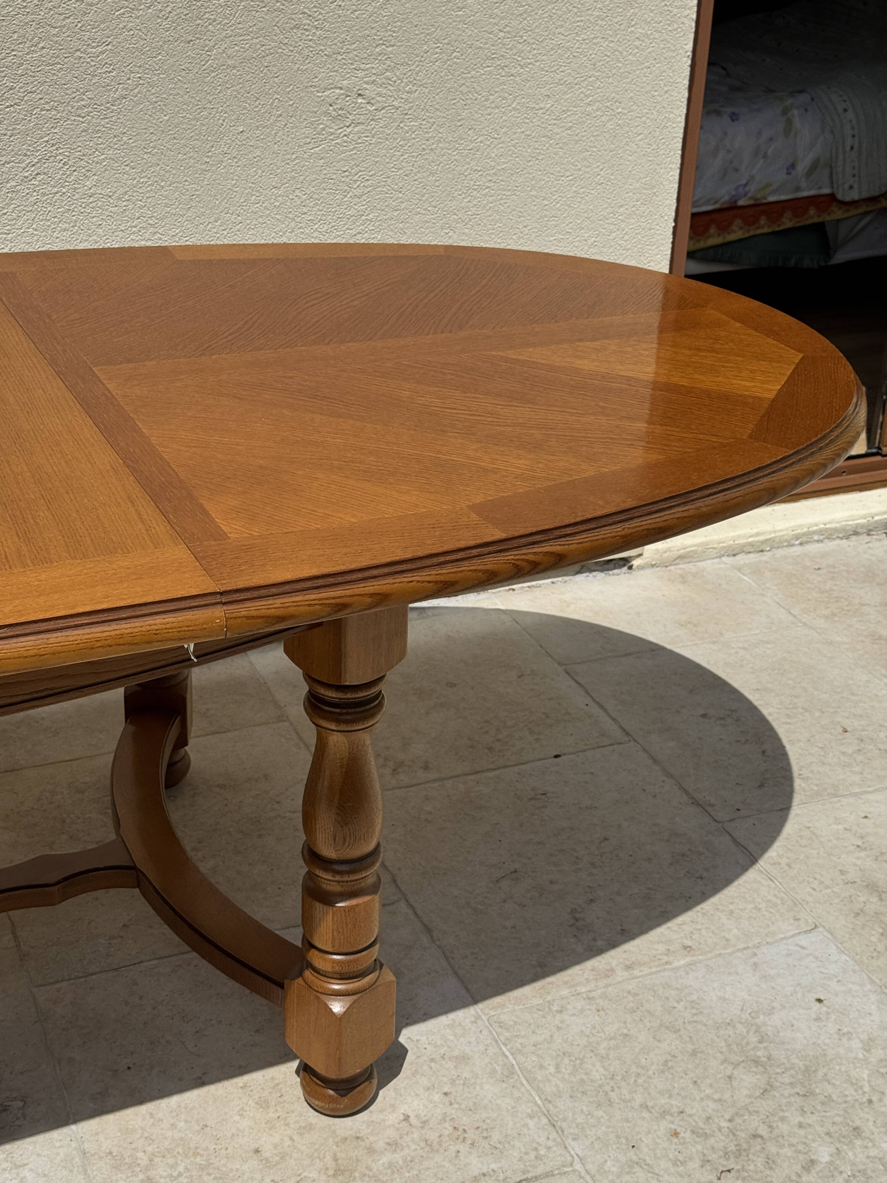 Oak dining table, oval living room table with two extensions.