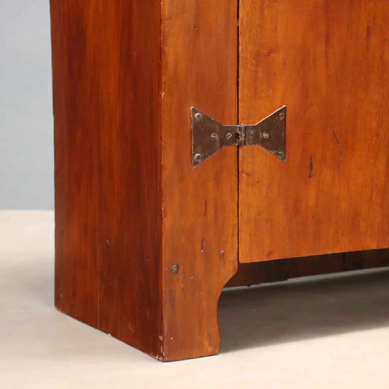 Vintage walnut wardrobe with exposed hardware.