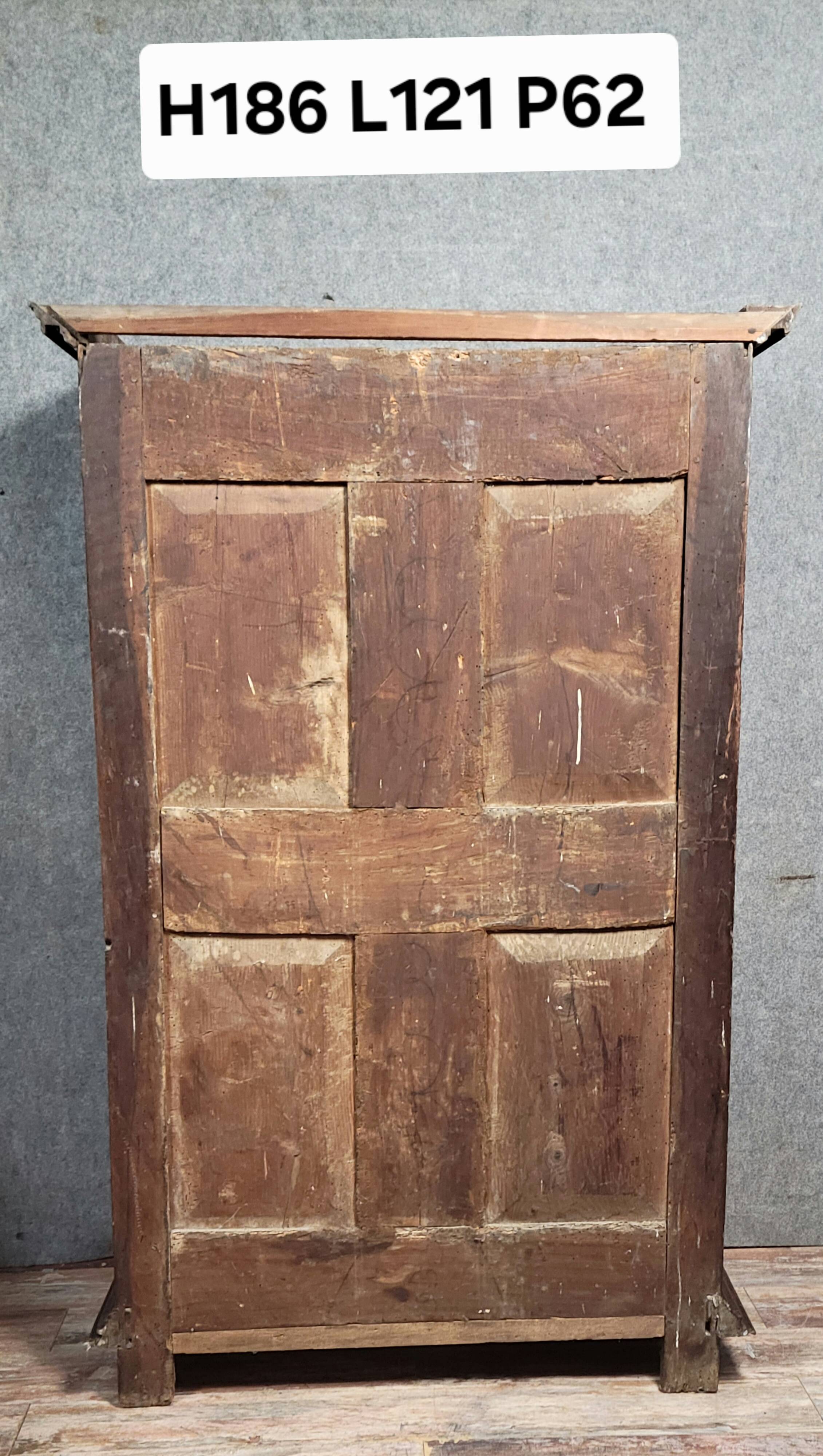 Renaissance style wardrobe in richly carved solid wood, 17th century