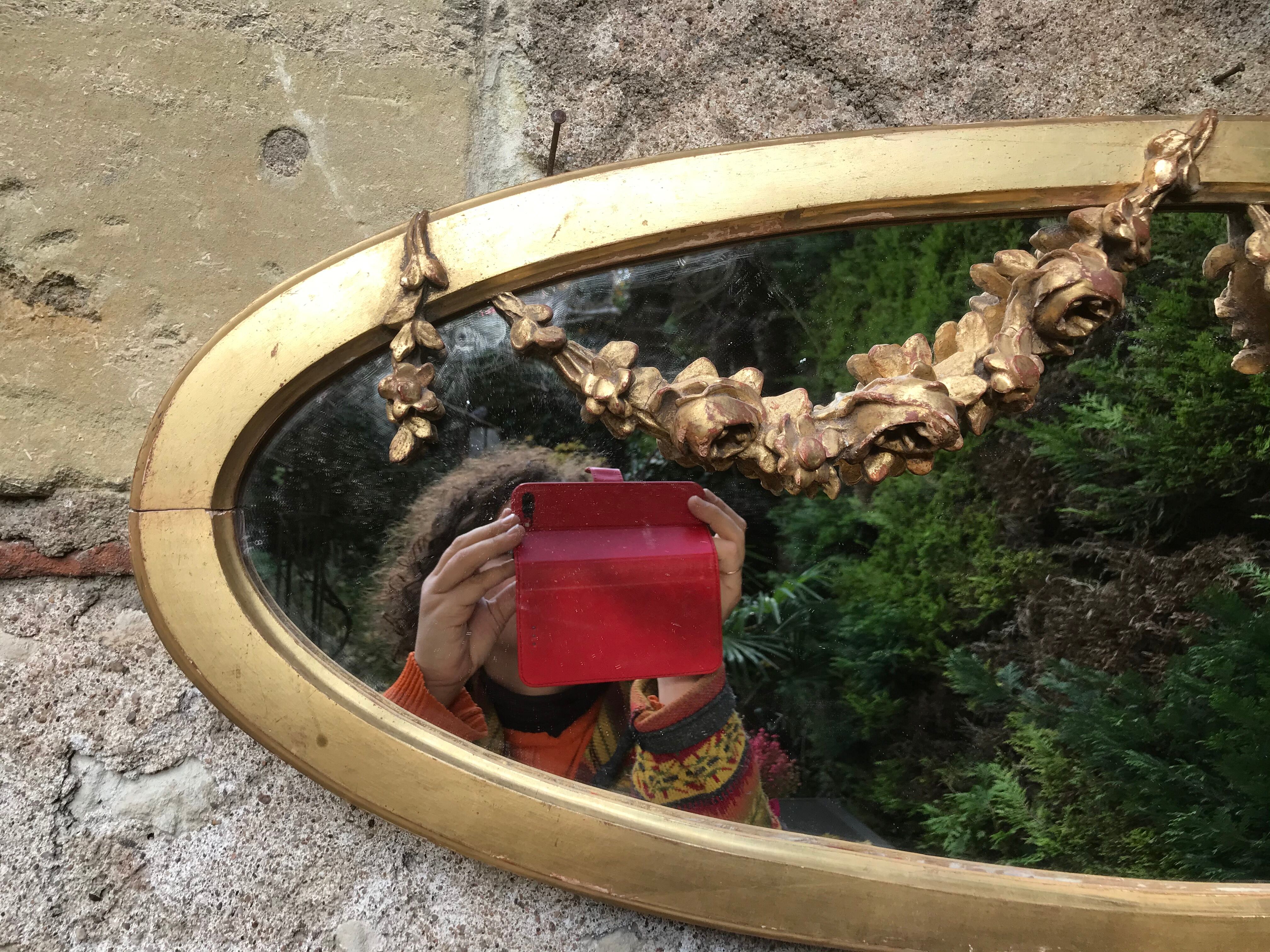 Golden oval mirror with gold leaf 106 x 38 cm