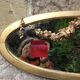 Golden oval mirror with gold leaf 106 x 38 cm