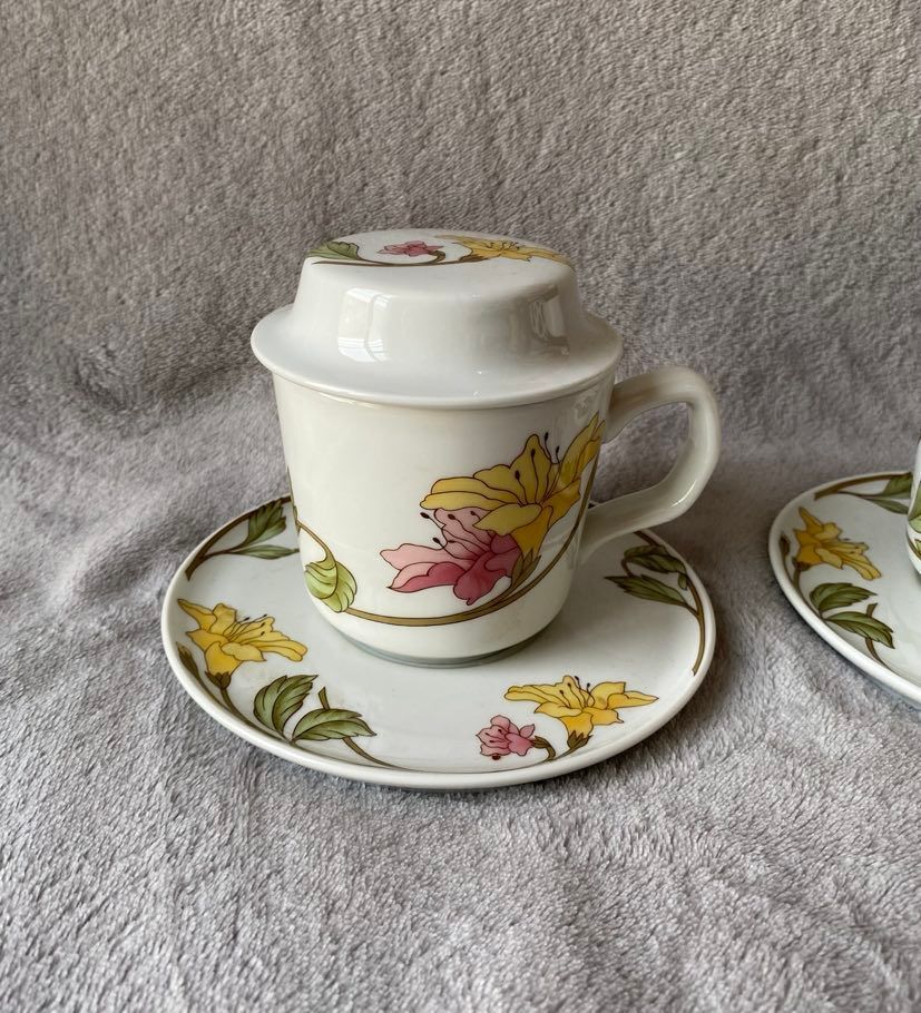 Two cups with herbal tea from the Faiencerie of Pillivuyt