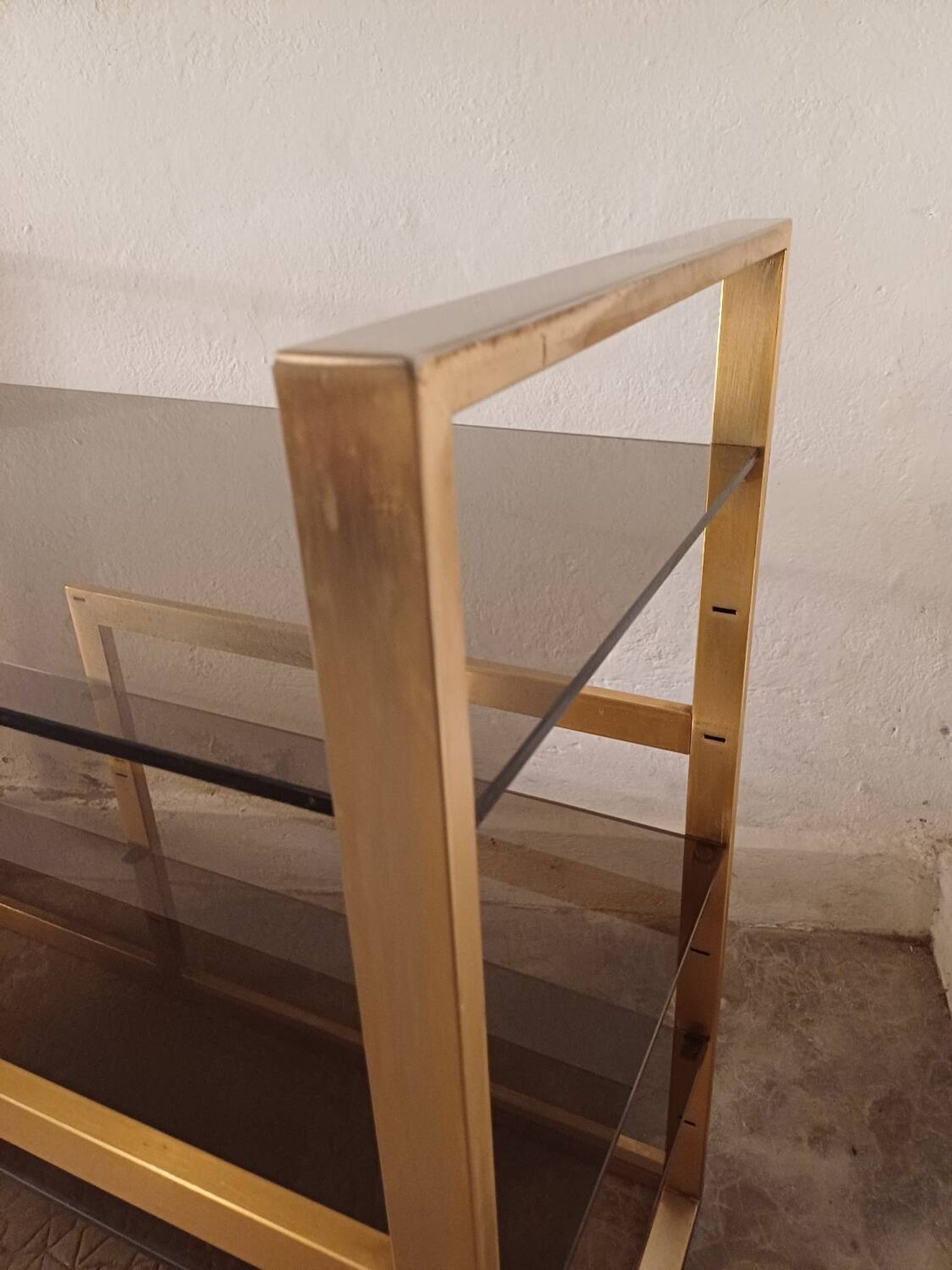 Brass shelf, smoked glass
