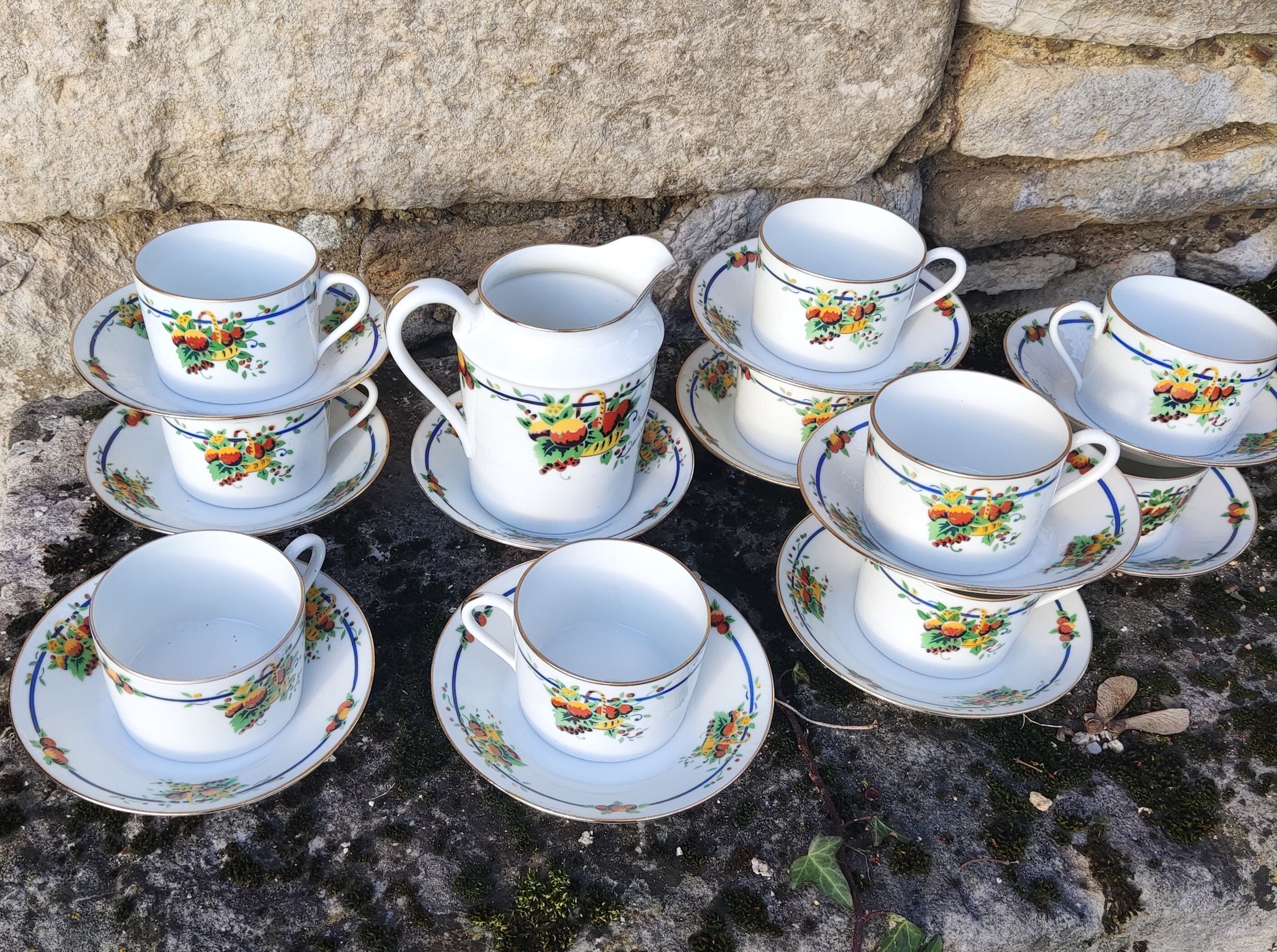 10 tea cups and creamer in Limoges porcelain