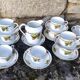 10 tea cups and creamer in Limoges porcelain