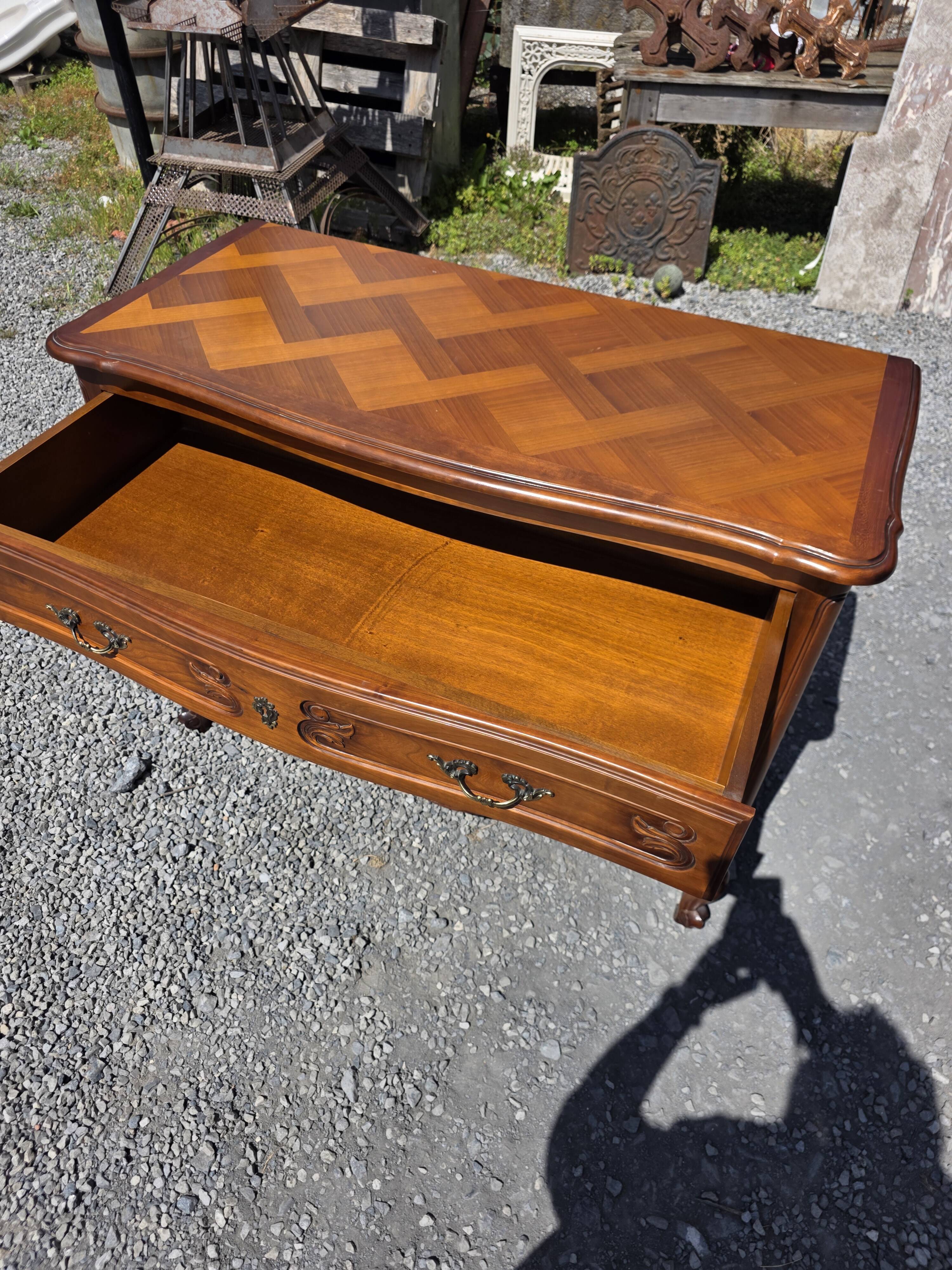Curved commode in Louis XV style made of cherry wood.