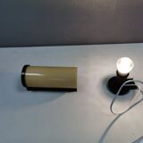 Old wall lamp, made of bakelite with a vanilla/egg colored glass shade.