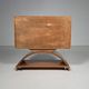 Mid-century modern mobile bar cabinet with sculptural base, 1950s.
