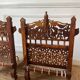 Pair of traditional Indian chairs made of carved wood and rope
