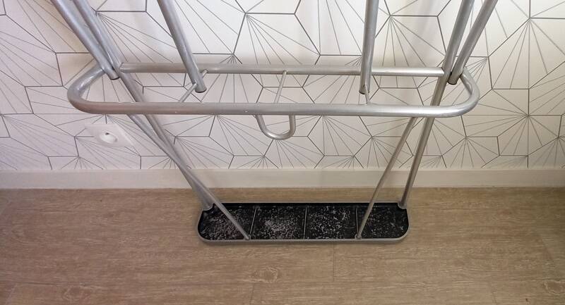 Vintage aluminum wall coat rack.