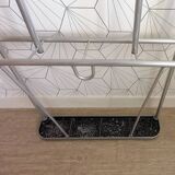 Vintage aluminum wall coat rack.