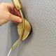 A set of "tulip" wall lamps in golden colored metal. Danish 1970-80s
