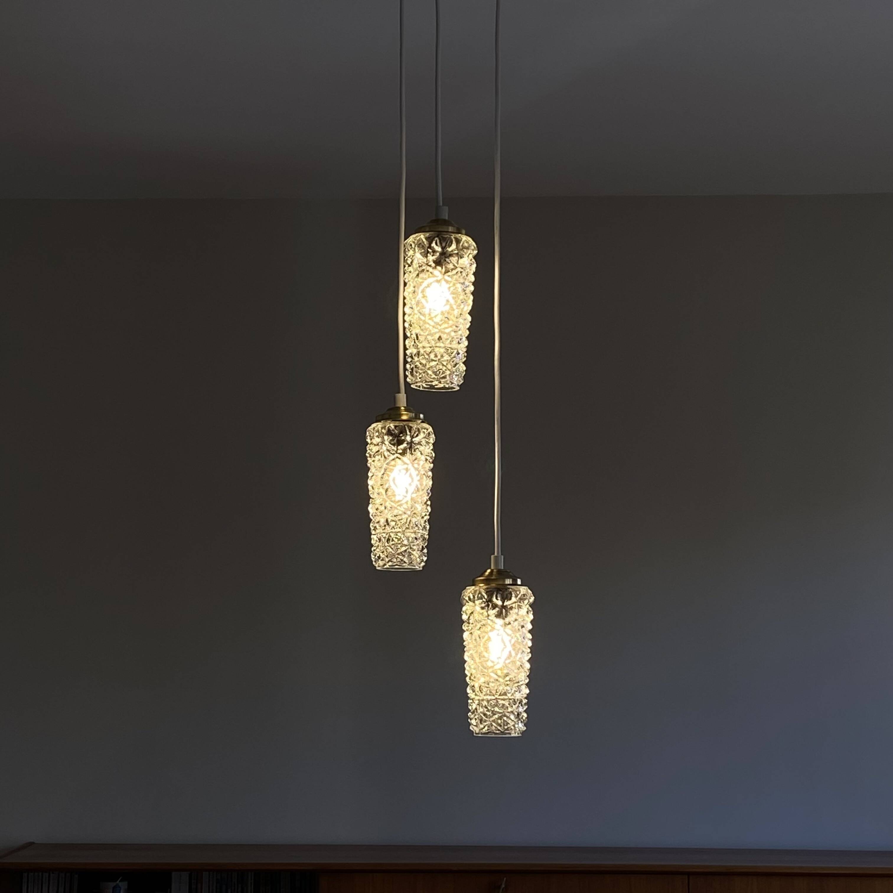 Cascade chandelier with 3 antique glass tulips, staircase