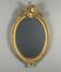 Oval gilded wooden mirror in Louis XV style, 19th century
