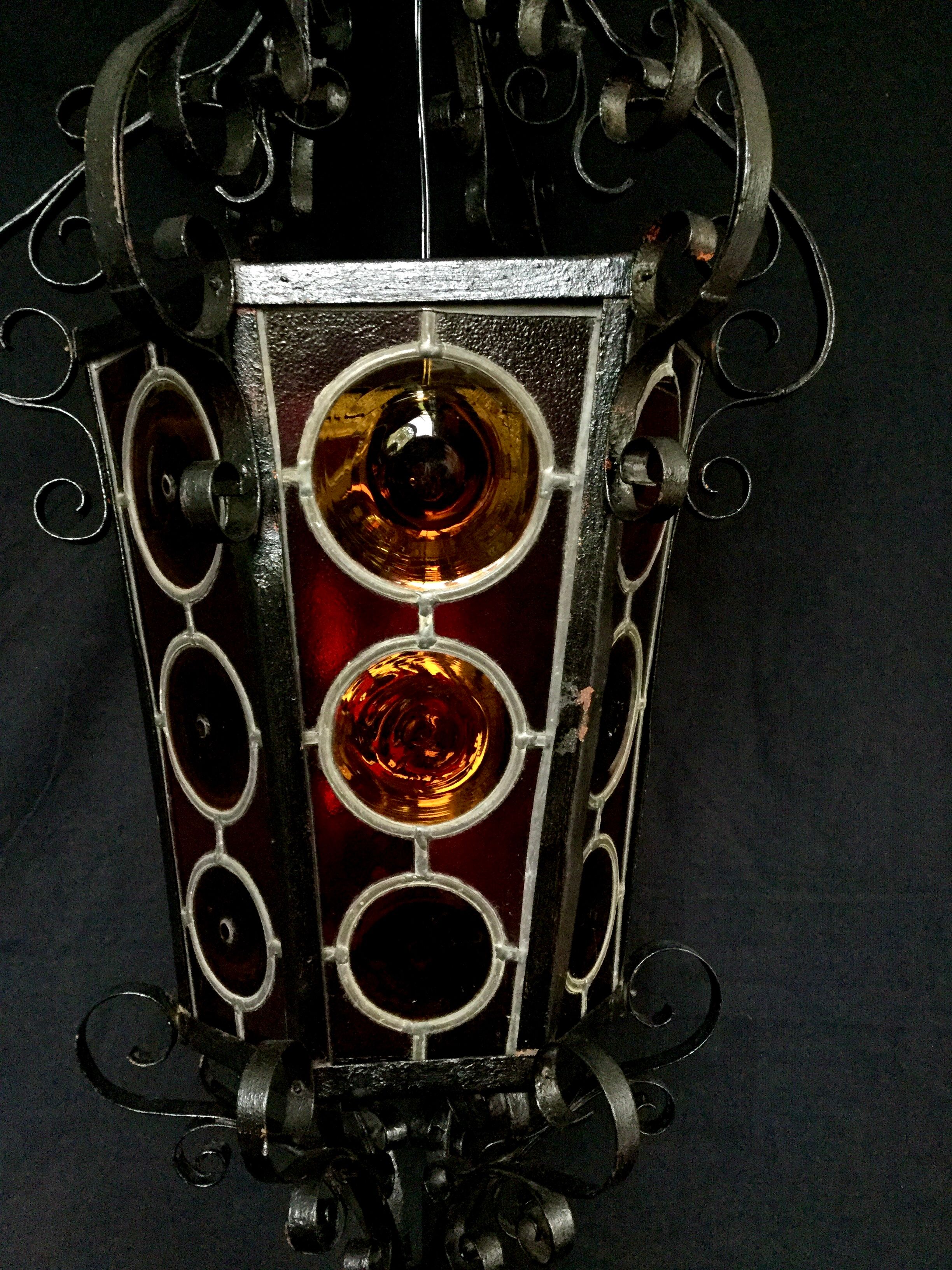 Wrought iron lantern and stained glass windows