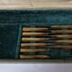 Set of 12 large knives and 11 horn and steel dessert knives