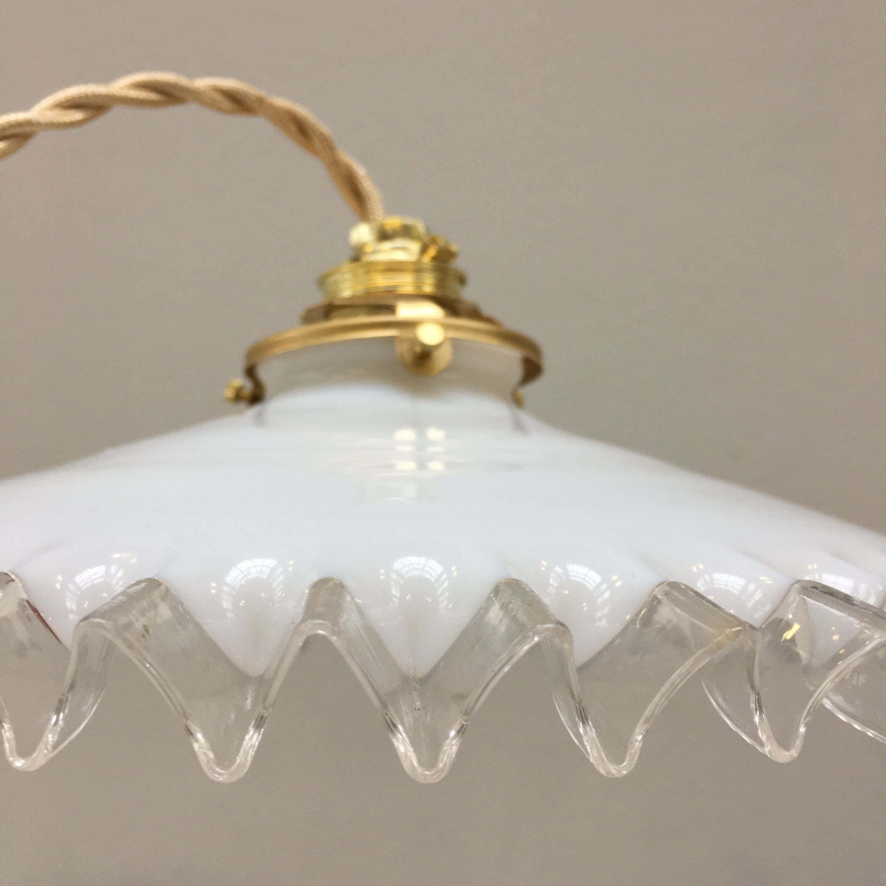White opaline pendant lamp with transparent serrated edges