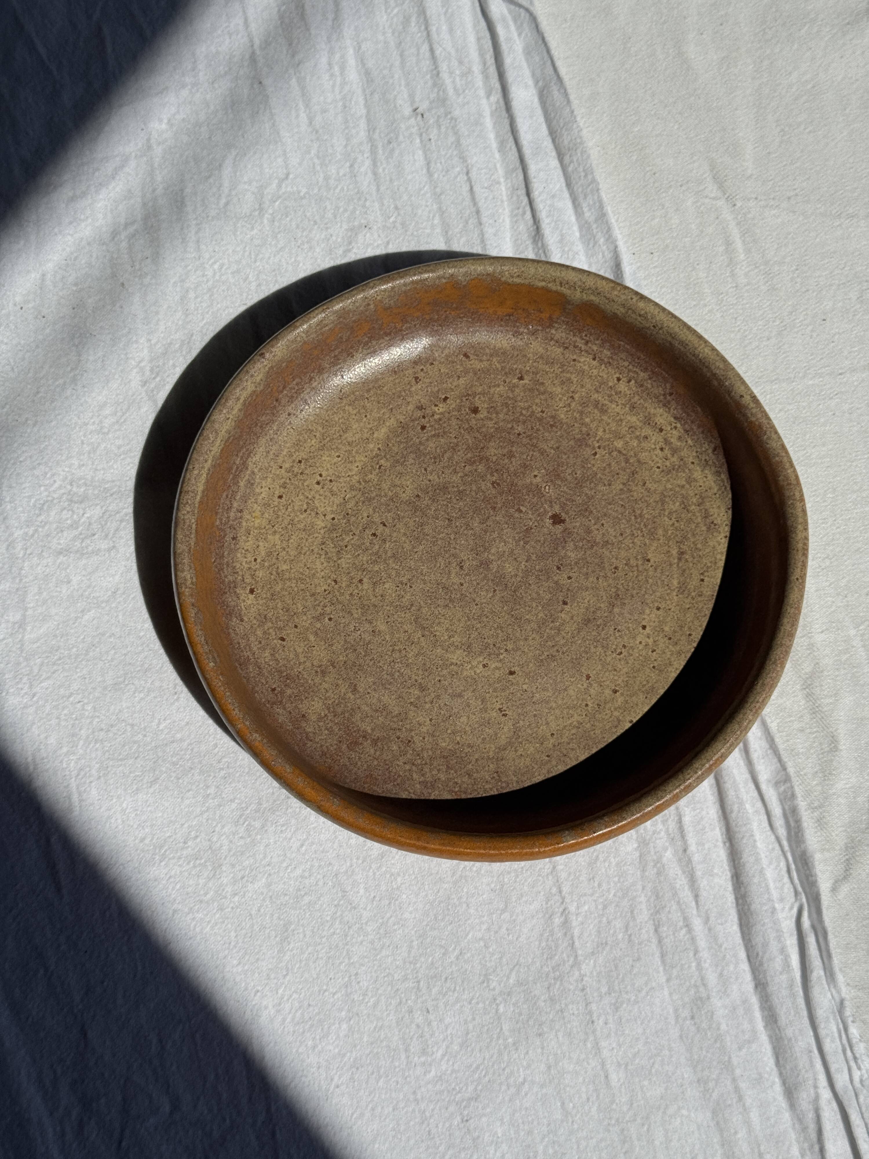 A small vintage circular stoneware deep dish D19