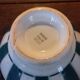 Old green and white digoin brand bowl