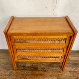 Modernist vintage chest of drawers in light chene has 3 drawers rattan top changing table