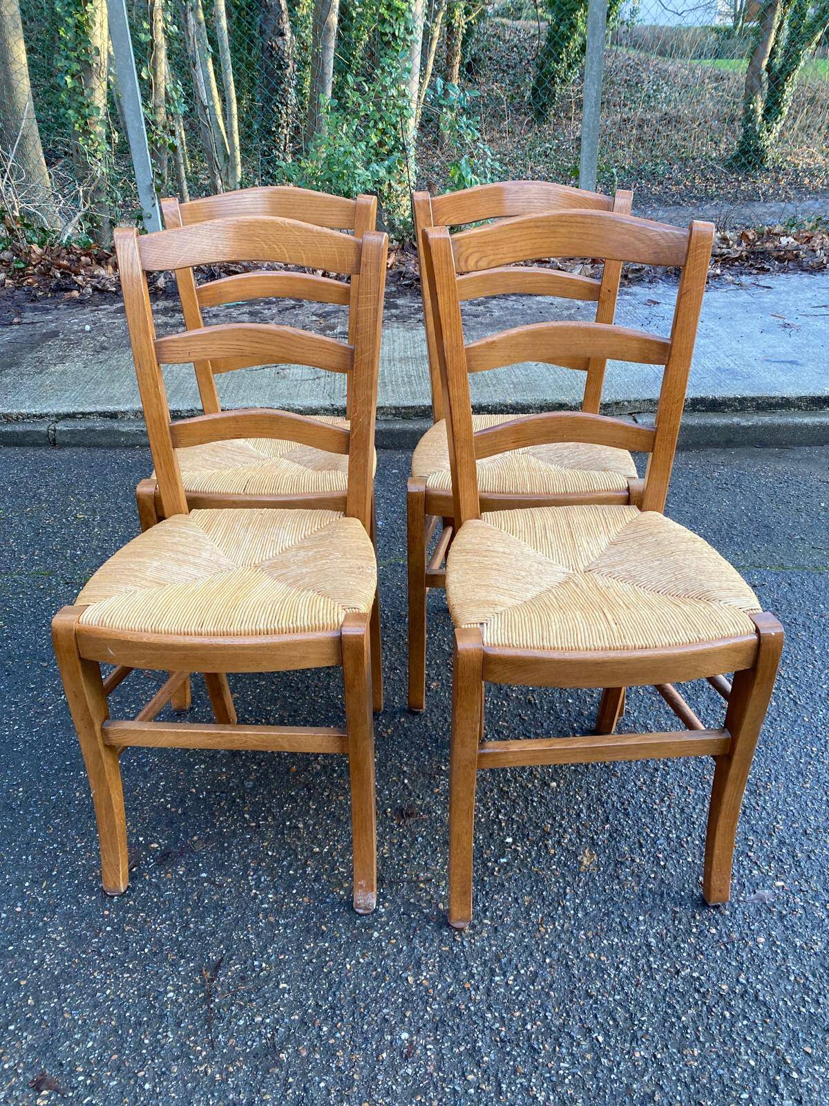 4 solid wood straw-seated Louis Philippe chairs, oak, 20th century.