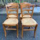 4 solid wood straw-seated Louis Philippe chairs, oak, 20th century.