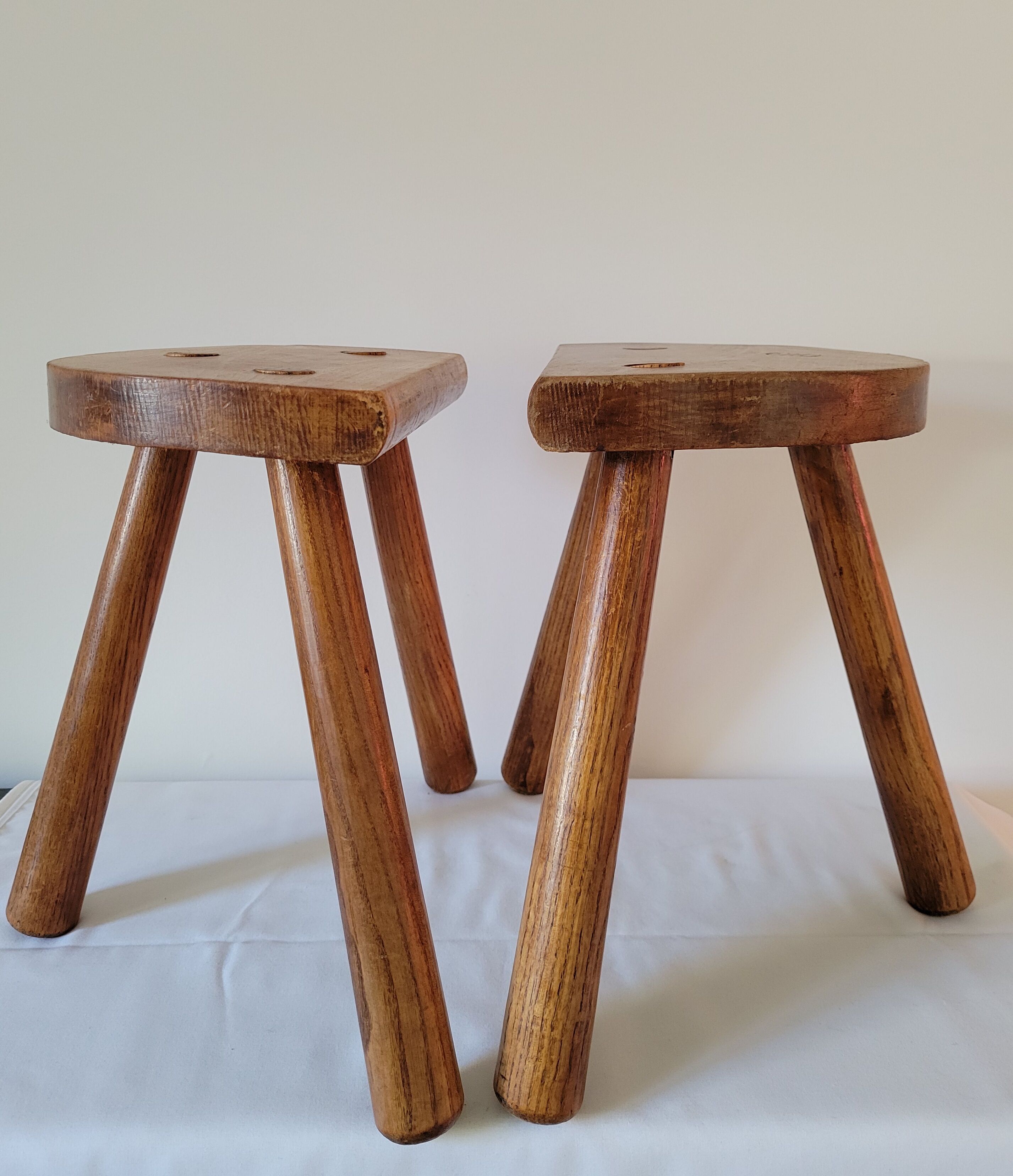 Pair of half-moon tripod stools