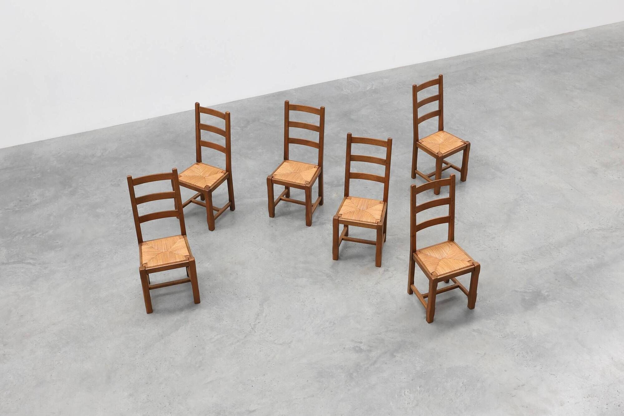 Set of 6 rustic oak ladder-back chairs with rush seats, France, 20th centur