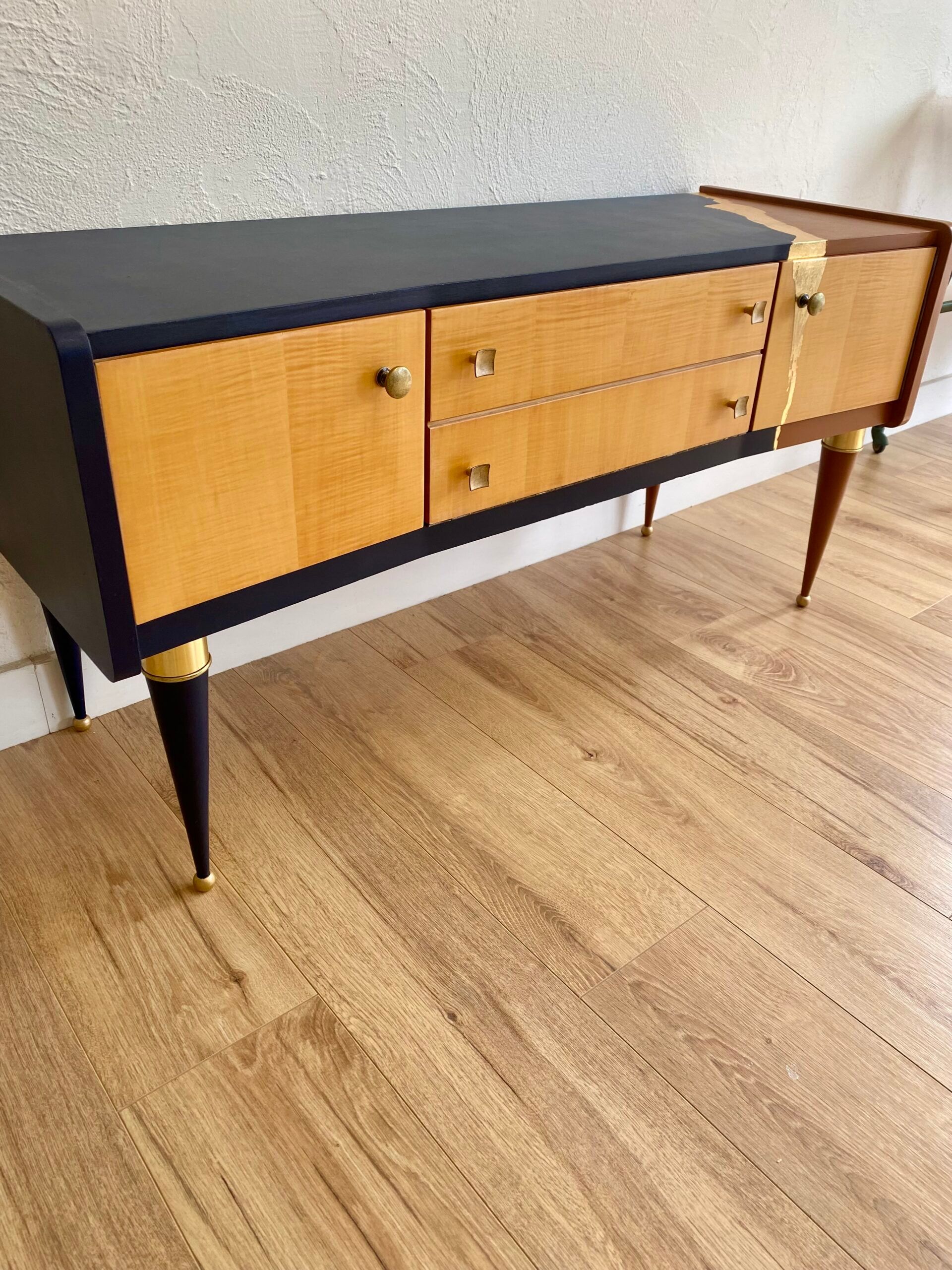Vintage furniture revamped in navy blue, terracotta, and gold leaf – Reimagined mid-century style.
