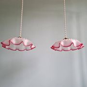 Pair of clear and pink satin glass scalloped pendant lights, 1920s-30s