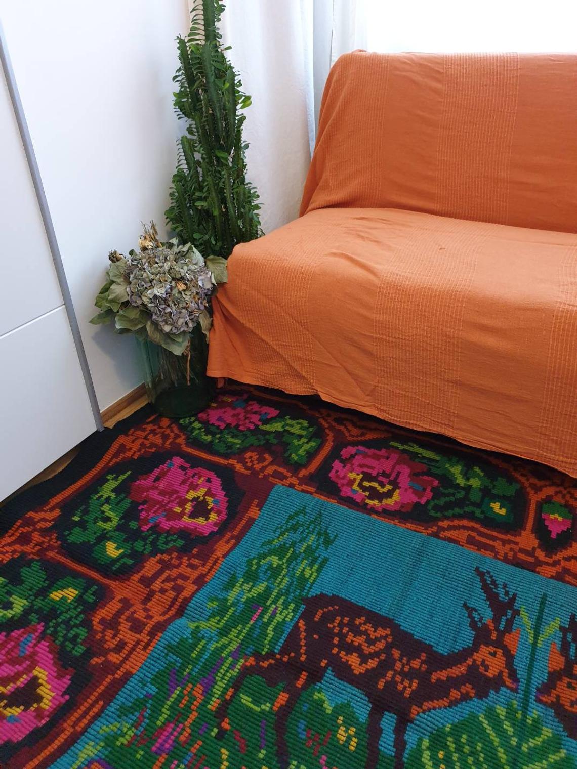 Vintage Romanian rug with deers, nature scenery on a floral background