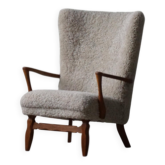 Viggo Boesen, high-back chair in oak and shearling lambskin, modern Danish design, 1950s.