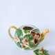 Tea service consisting of a teapot, a milk jug and a numbered hazelnut slip sugar bowl
