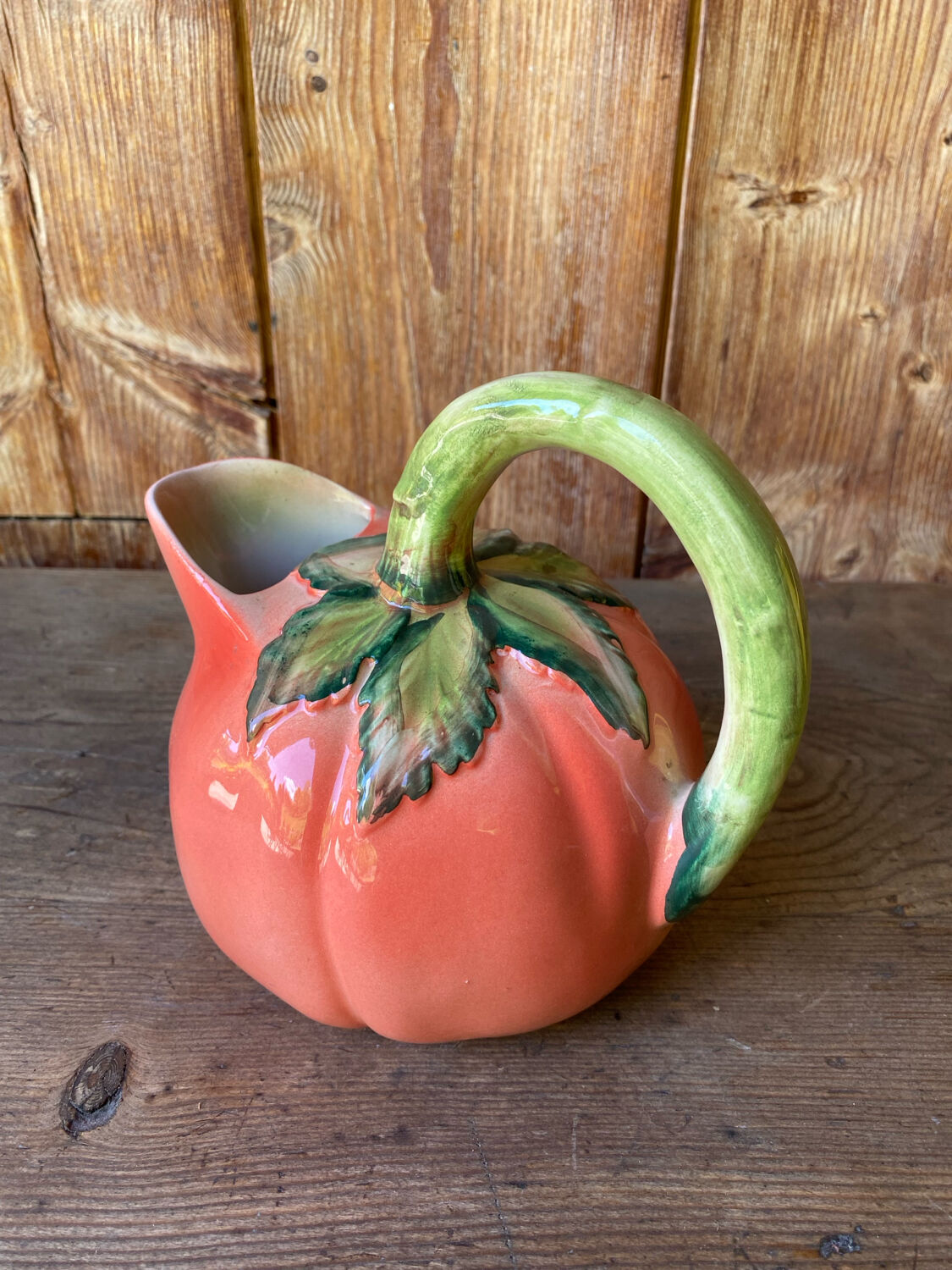 Jug in tomato slipware