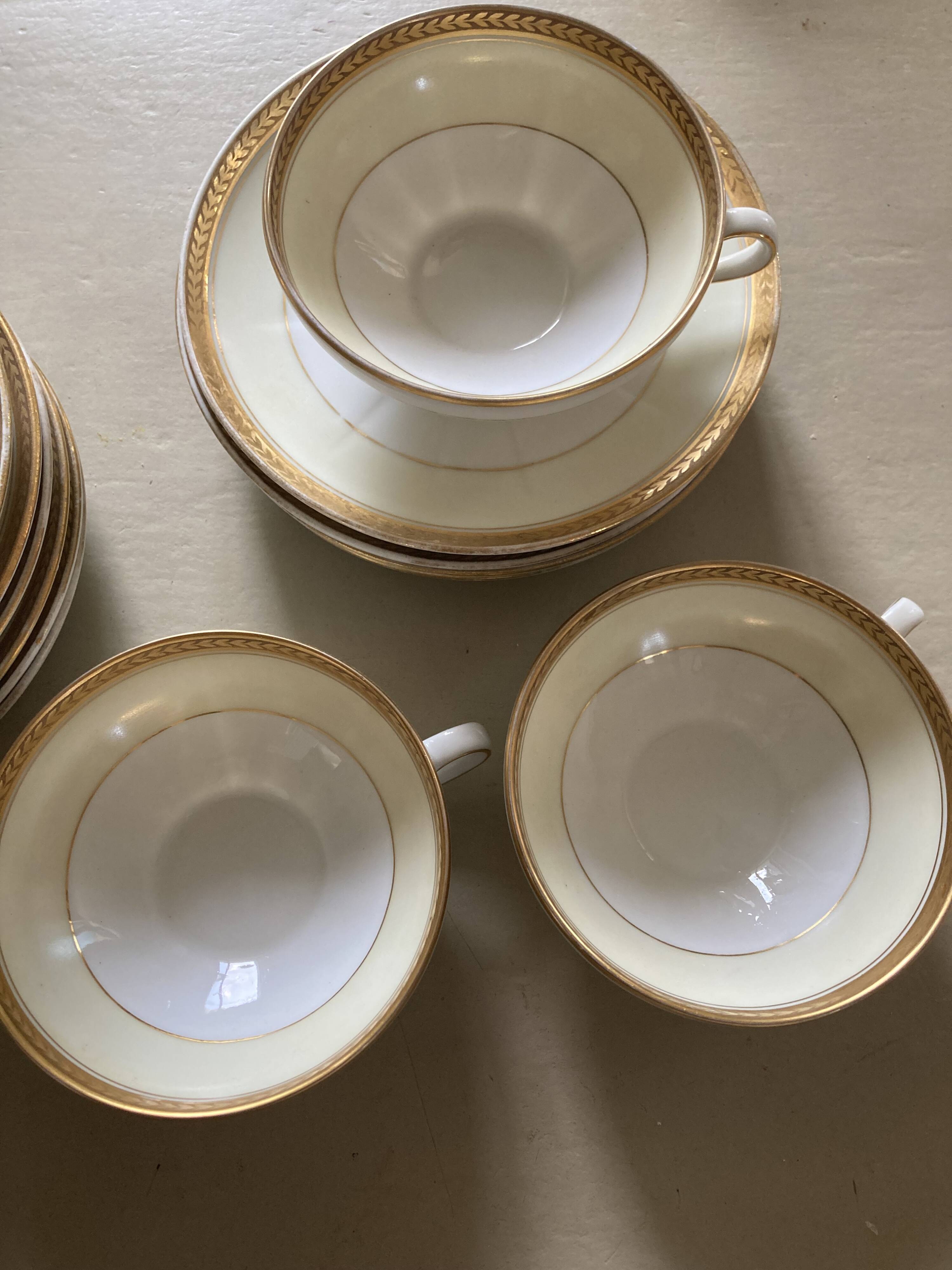 Vintage Limoges porcelain chocolate teacups in pastel yellow and gold