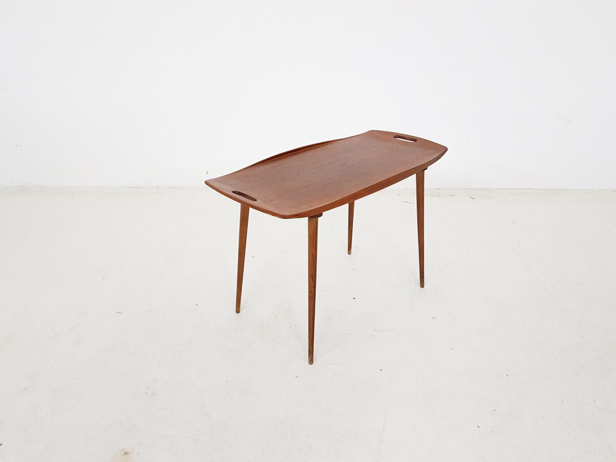 Teak side table with handles by Jens Quistgaard