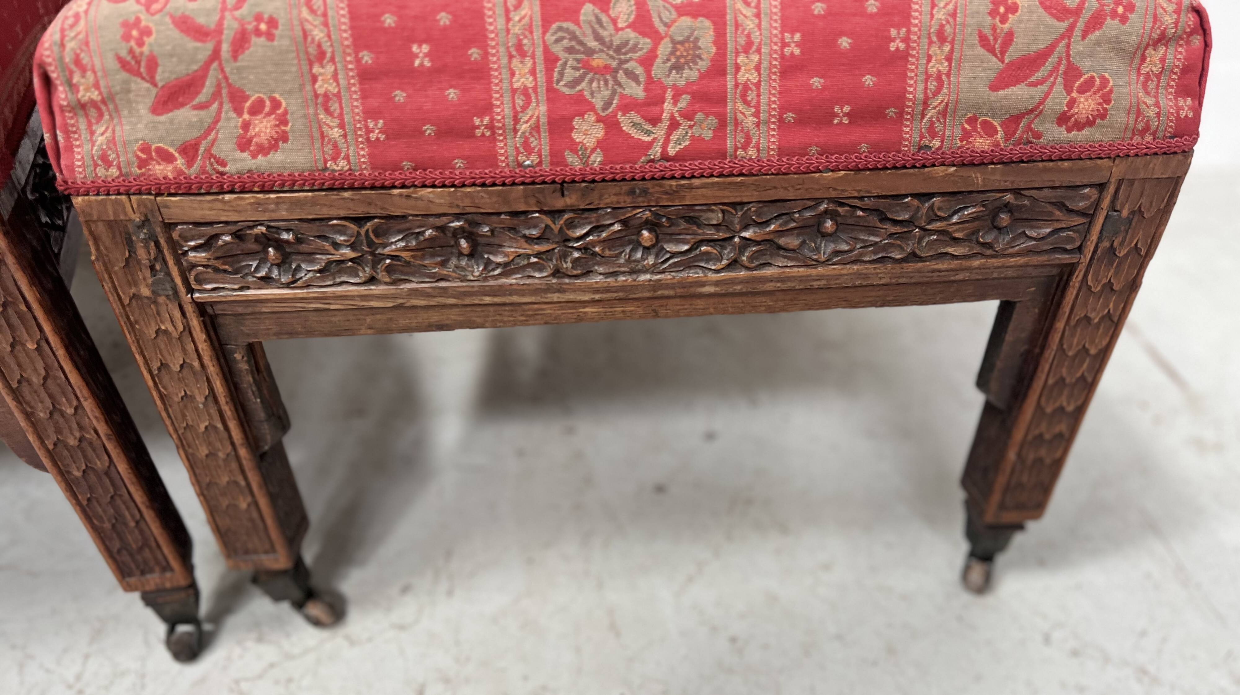 Pair of Gothic-style walnut lounge chairs, 19th century