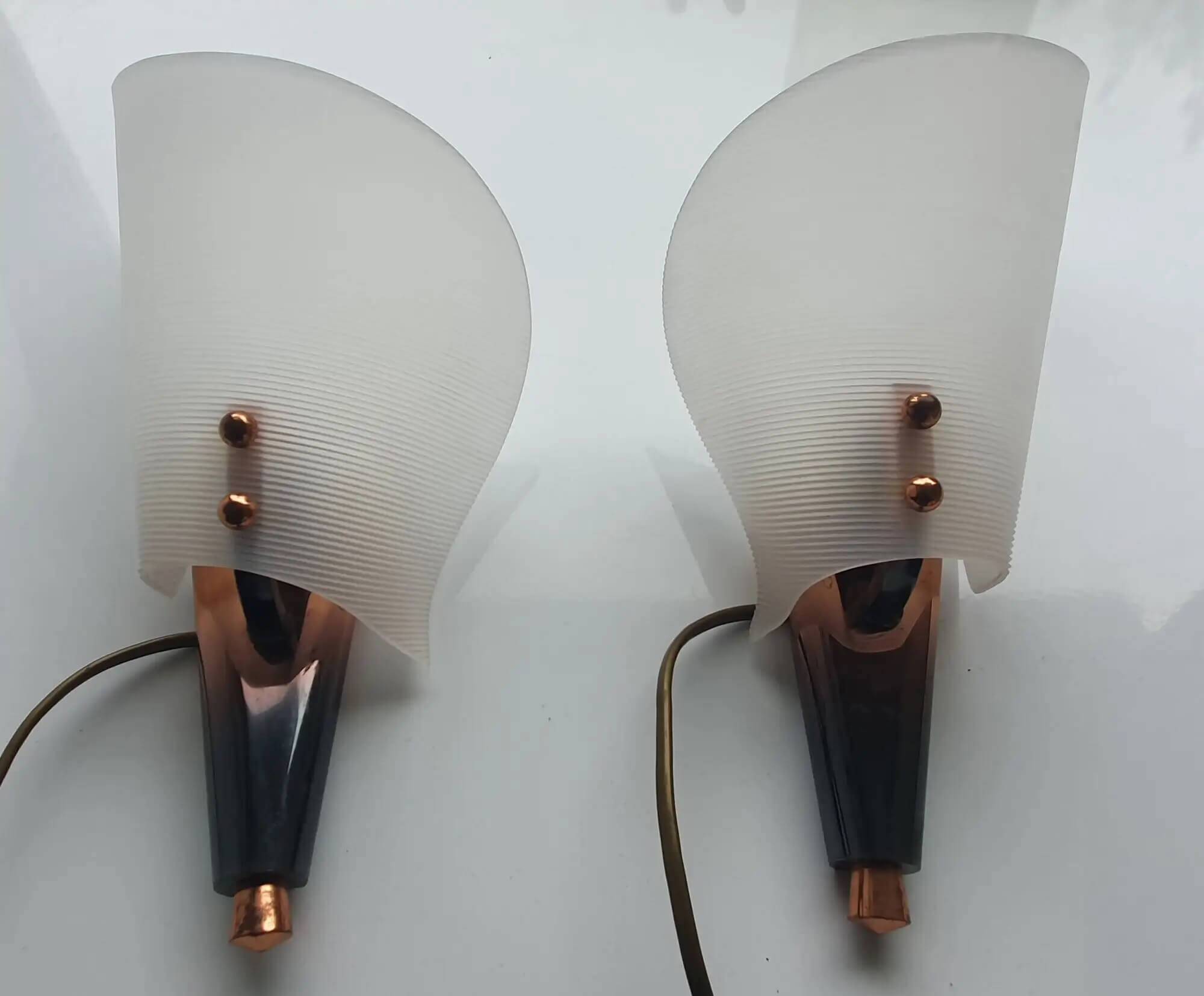 Pair of copper and plexiglass torch wall lights from the 1960s