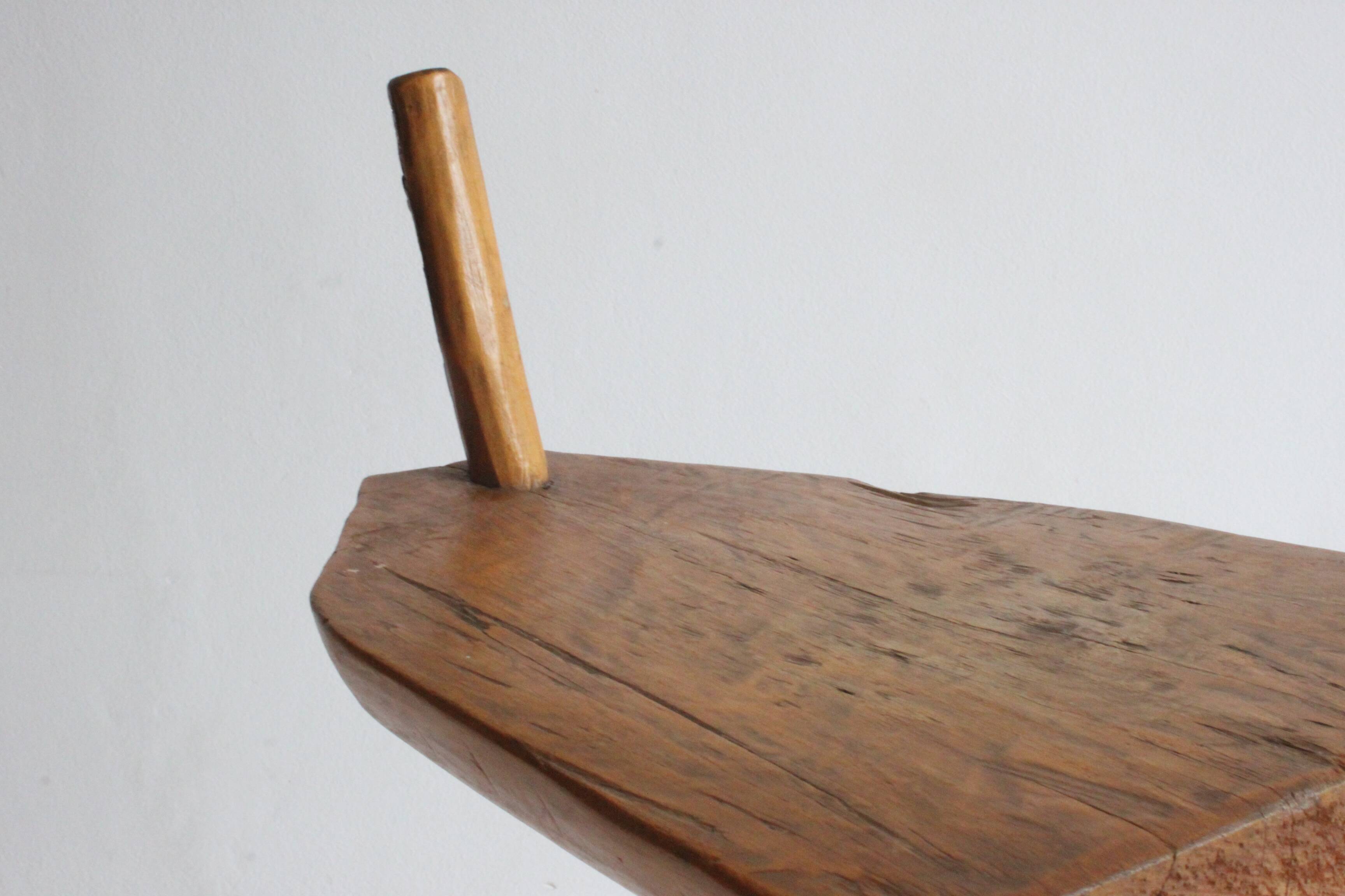 Brutalist tripod stool in carved wood, 1950s