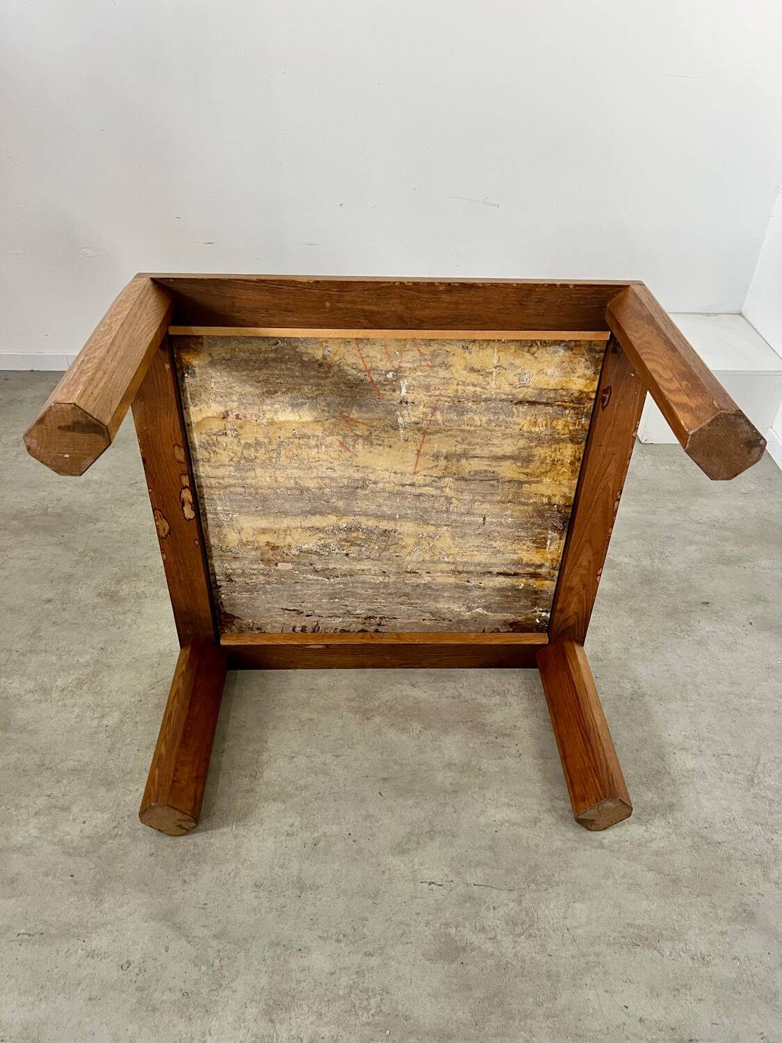 Old coffee table with golden marble top, 70s design, vintage wooden feet