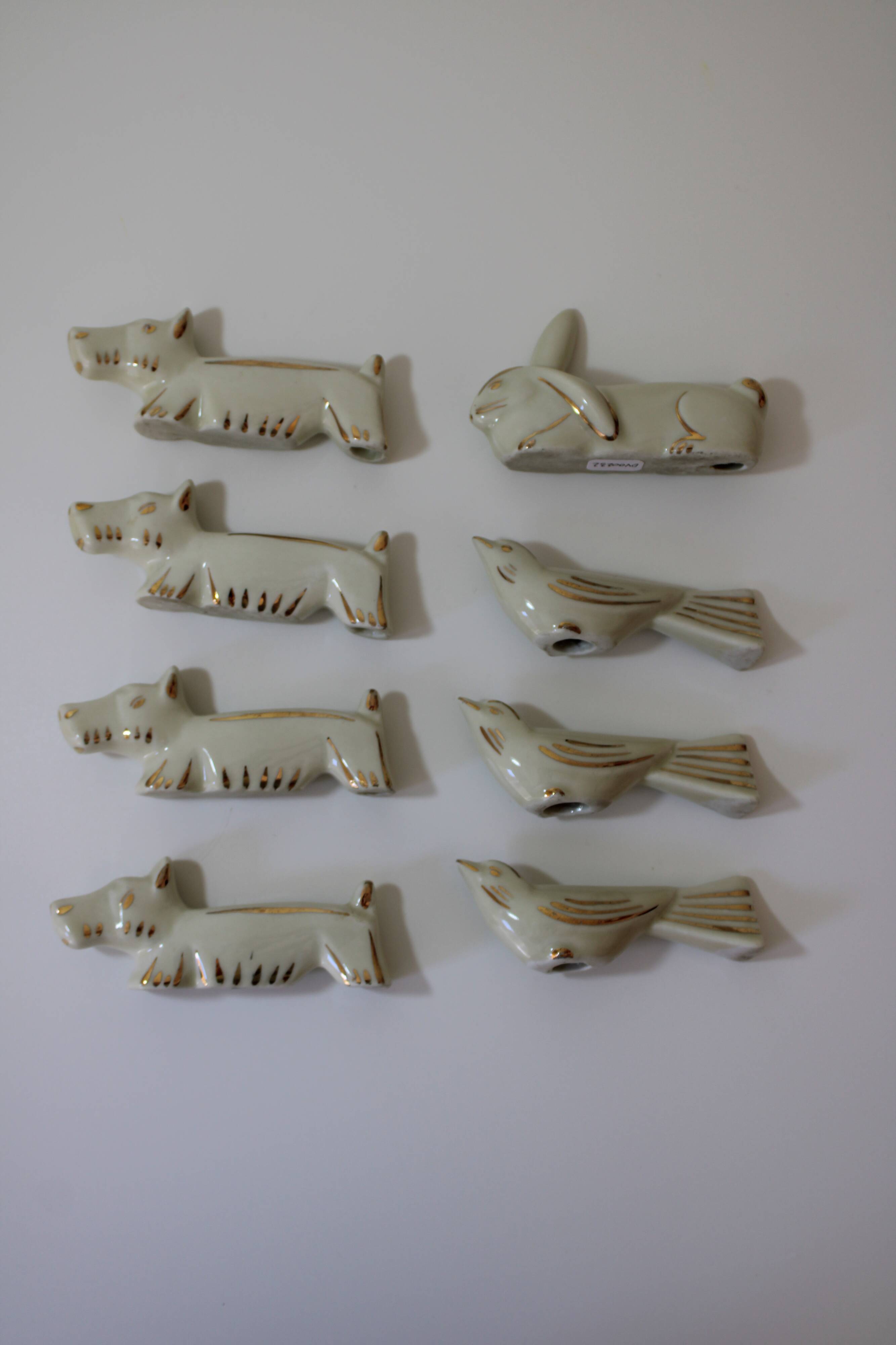 8 portes couteaux animaux porcelaine de Limoges vintage
