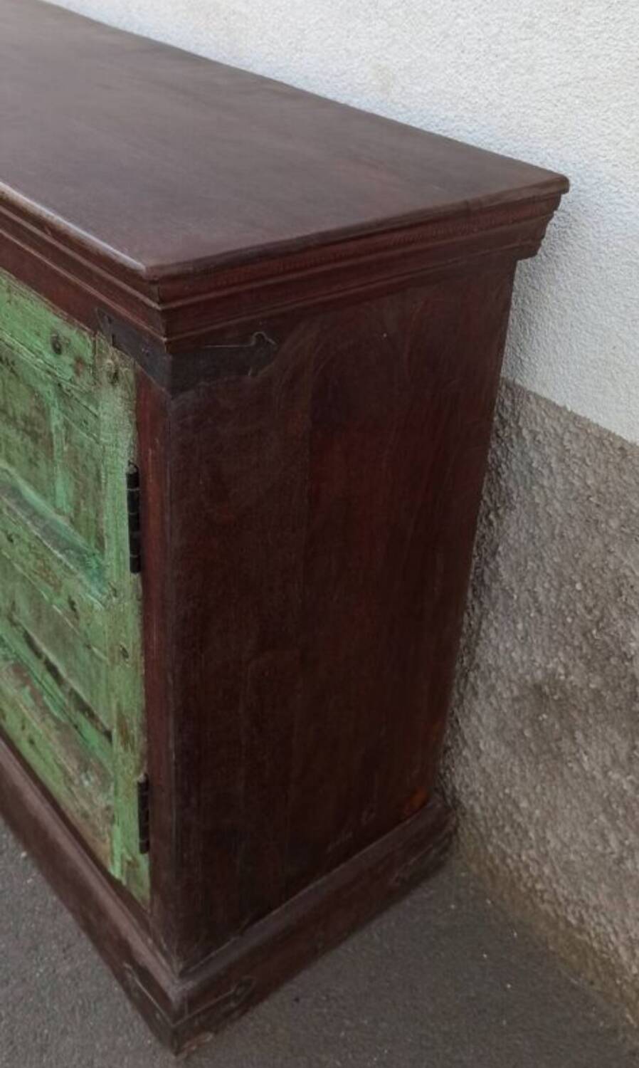 Long wooden sideboard with old green doors
