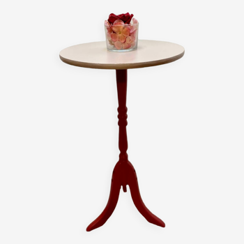 Small taupe and burgundy wooden pedestal table