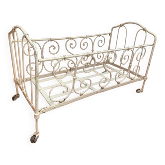 Old wrought metal doll bed