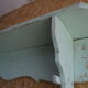 Patinated wooden wall shelf