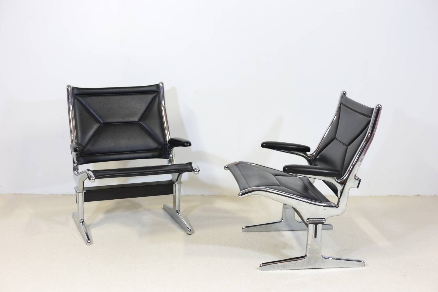 Pair of Eames Sling Tandem armchairs